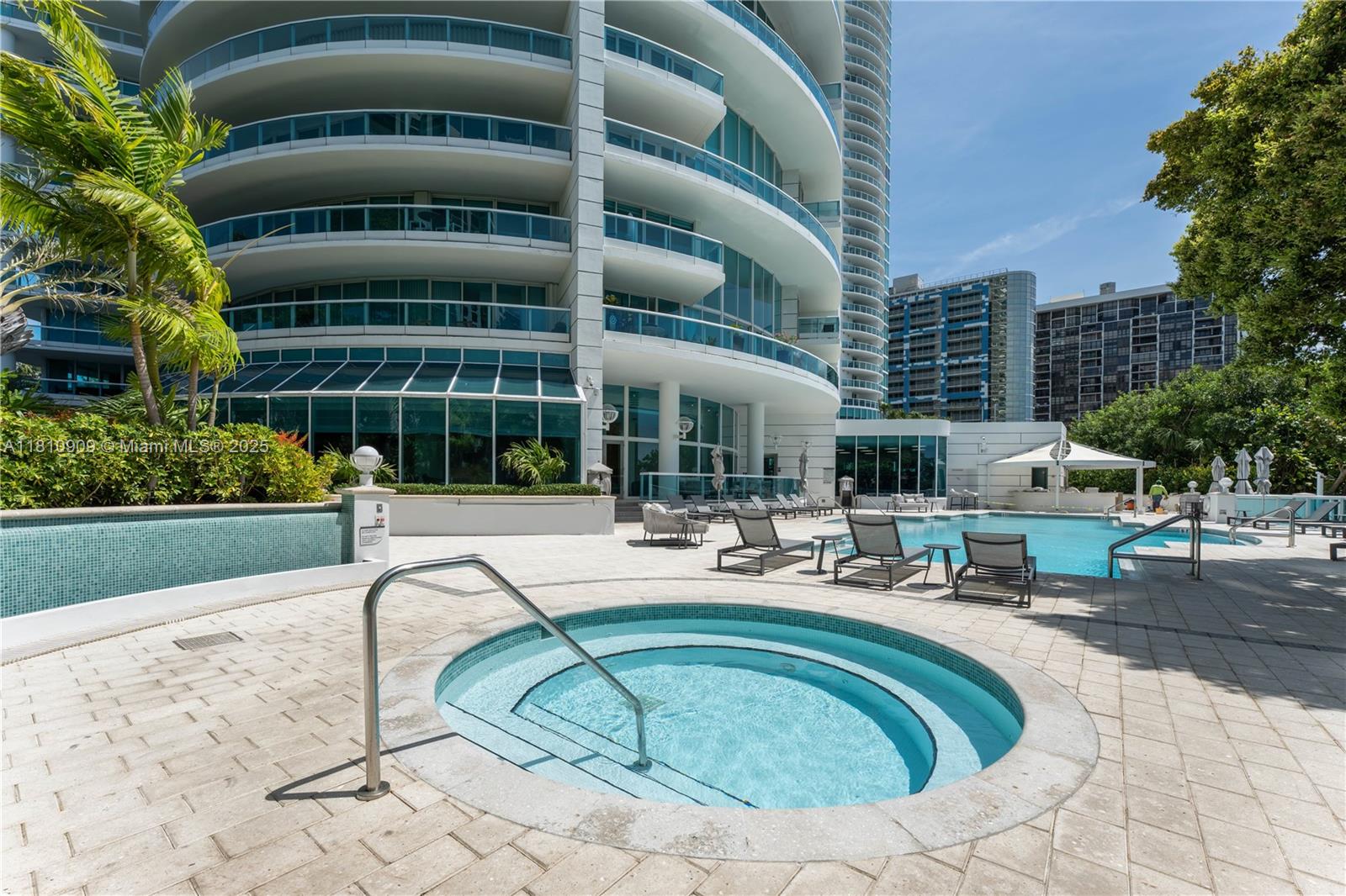 2127 Brickell Avenue, Unit 3304 Miami, FL 33129 - Photo 31 of 39 a swimming pool with outdoor seating and yard