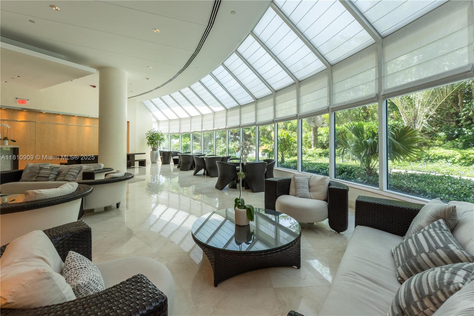 2127 Brickell Avenue, Unit 3304 Miami, FL 33129 - Photo 38 of 39 a living room with furniture and a large window