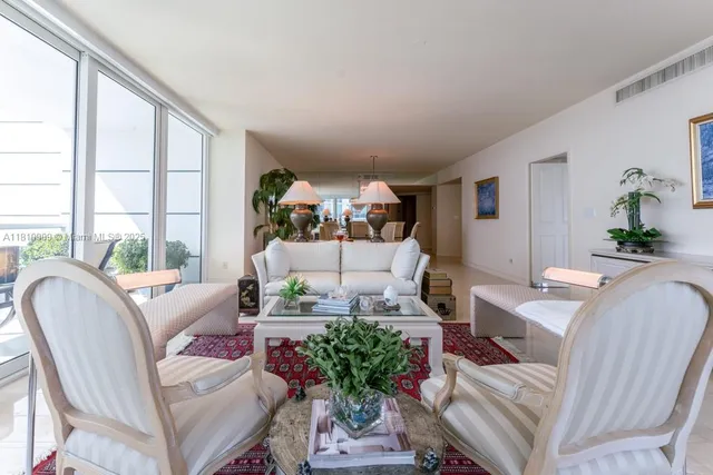 a living room with furniture or couch and a large window