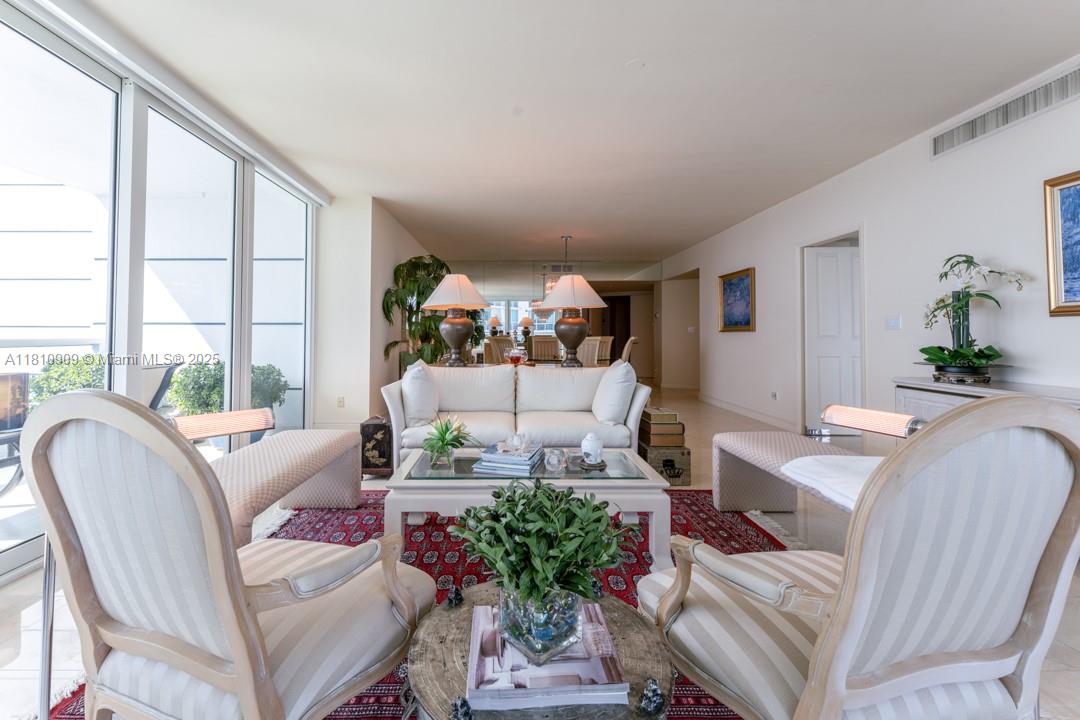 2127 Brickell Avenue, Unit 3304 Miami, FL 33129 - Photo 4 of 39 a living room with furniture or couch and a large window