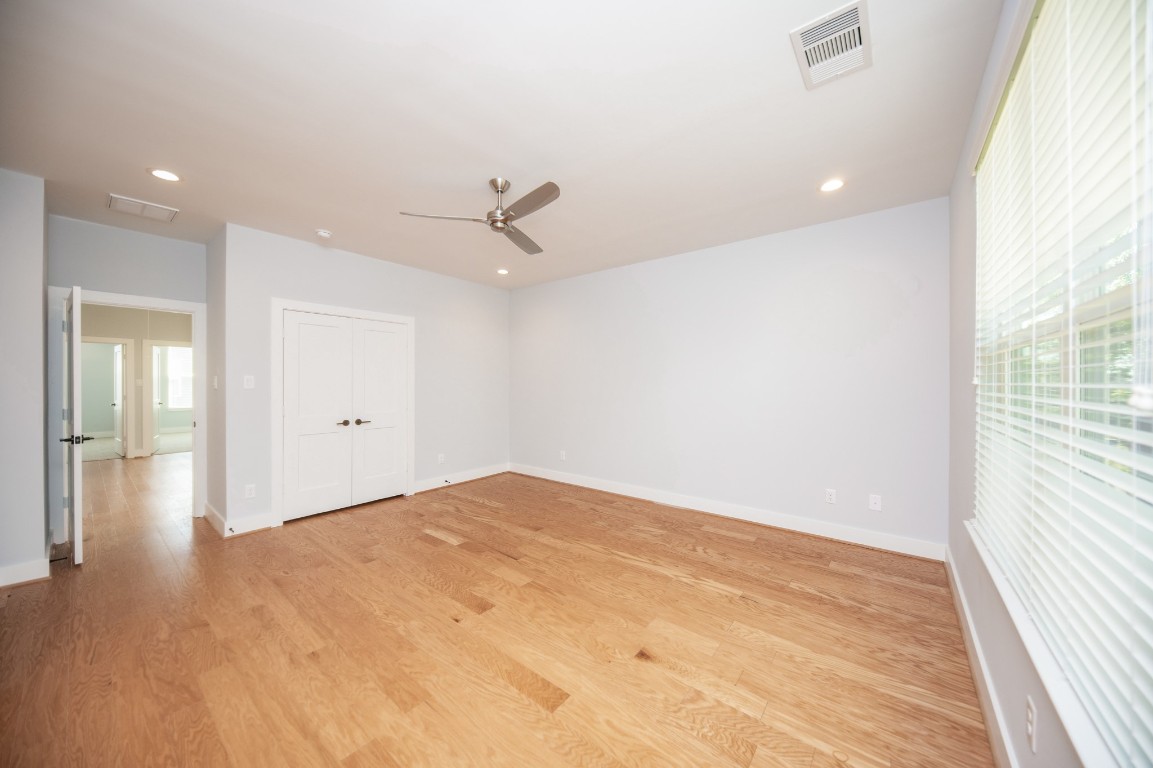 1860 West Tidwell Road Houston, TX 77091 - Photo 24 of 32 wooden floor in an empty room with a window