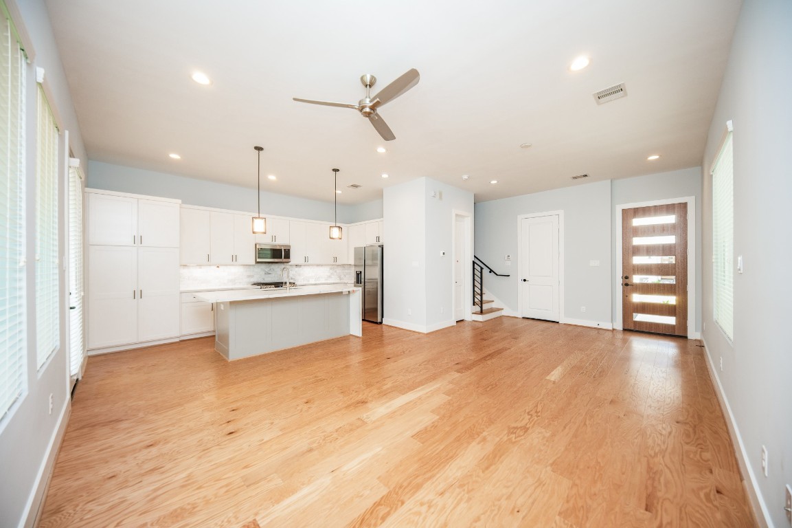 1860 West Tidwell Road Houston, TX 77091 - Photo 9 of 32 a view of kitchen with wooden floor and window