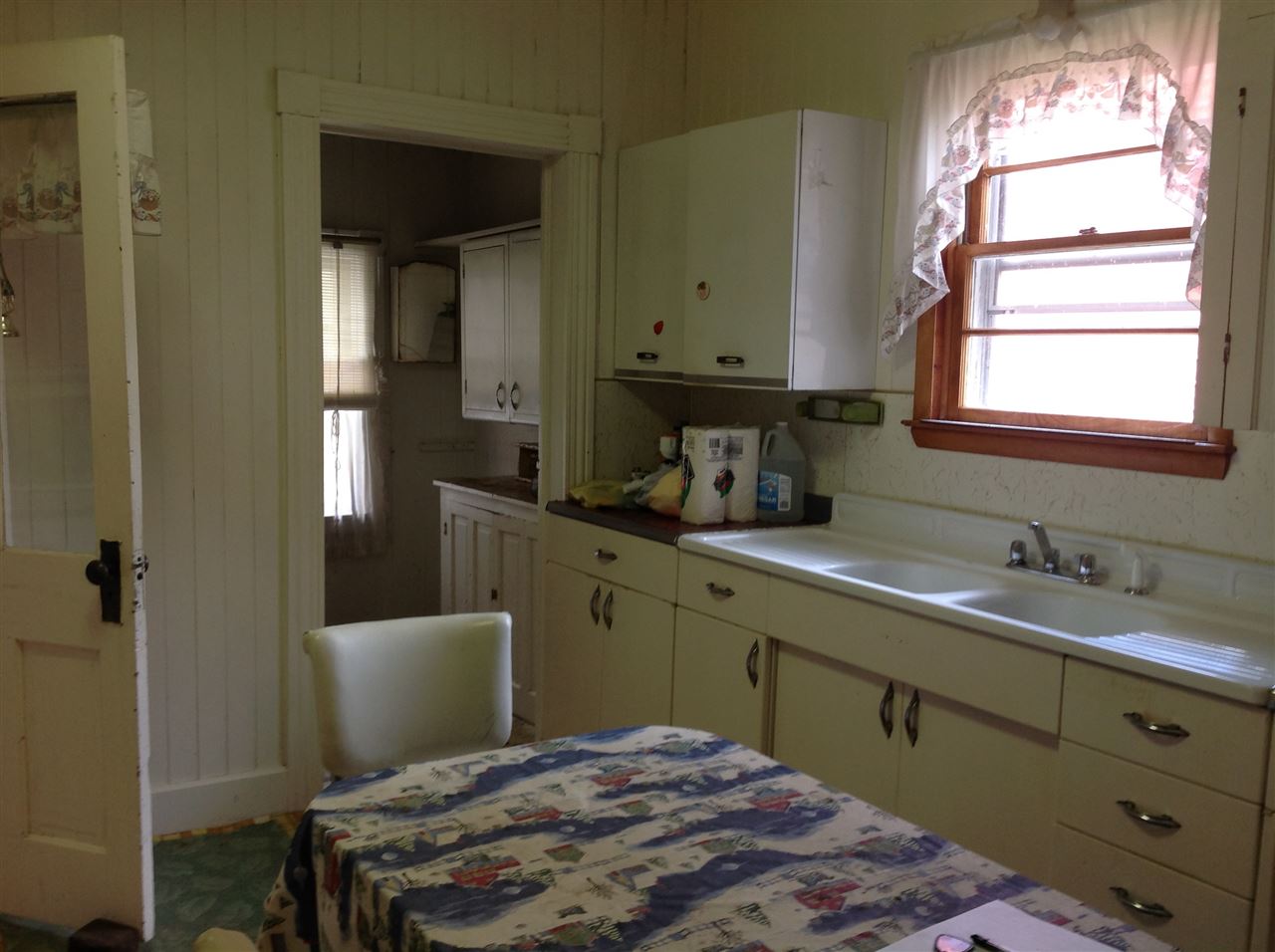 717 High Knob Road Blue Grass, VA 24413 - Photo 15 of 27 a kitchen with a stove a sink and a window