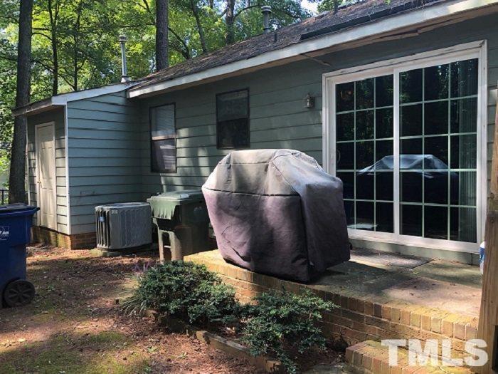 821 Barringer Drive, Unit A Raleigh, NC 27606 - Photo 8 of 8 a view of a backyard with table and chairs