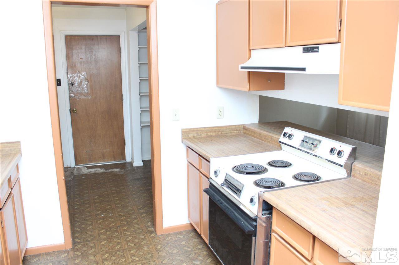 3380 West 7th Street Reno, NV 89503 - Photo 8 of 25 a kitchen that has a stove and a table