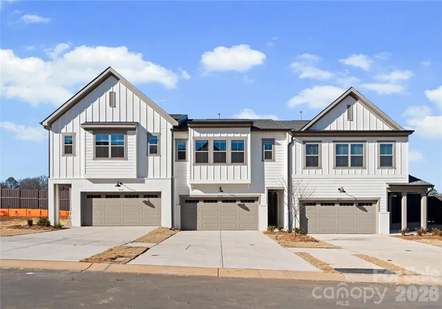 a front view of a house with a garage