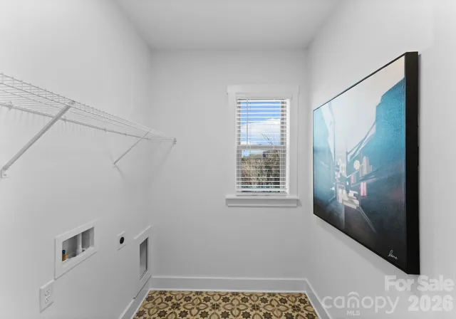 a bathroom with a sink a toilet and window