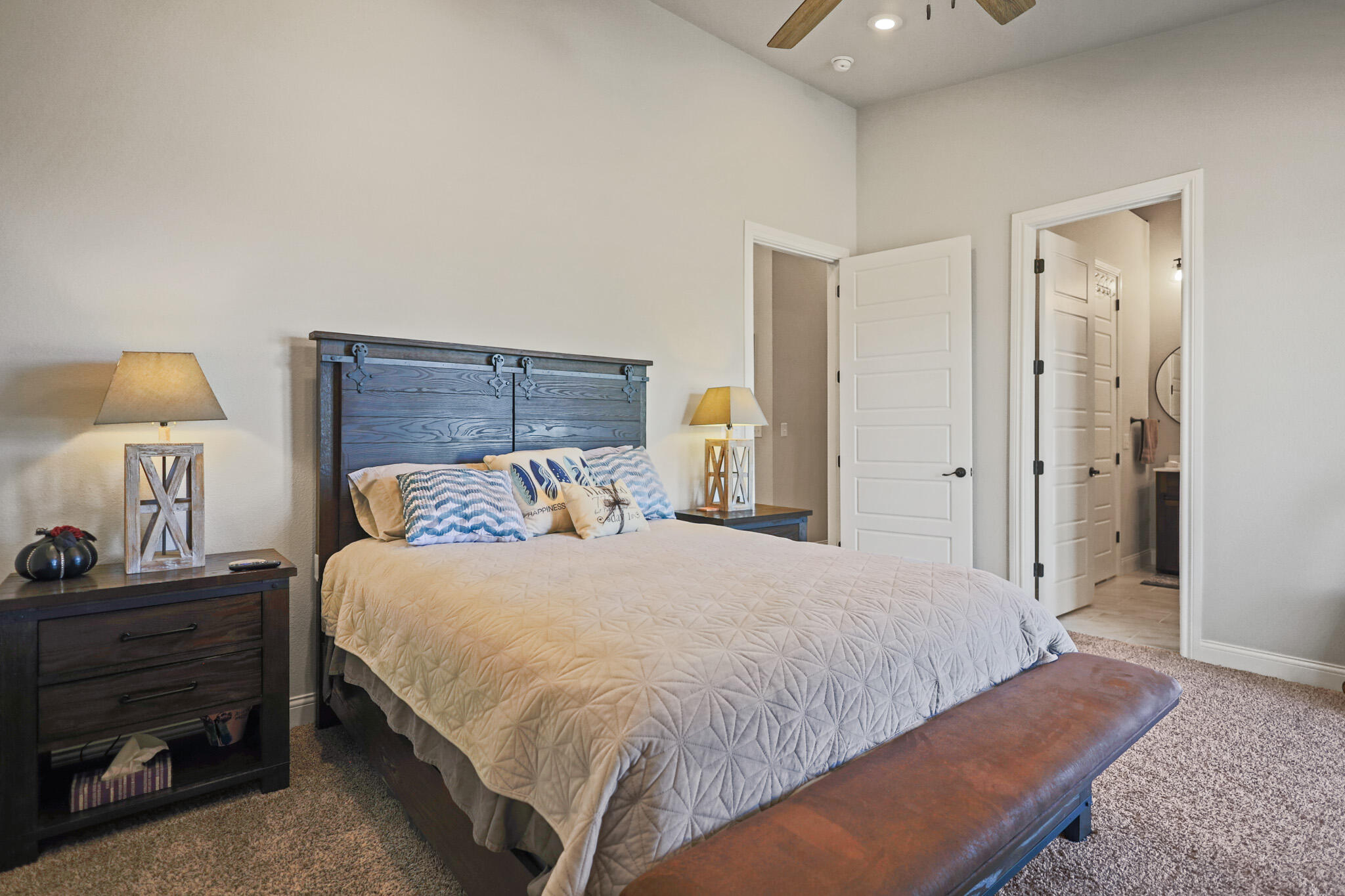 301 Fagan Road Snyder, TX 79549 - Photo 57 of 102 a bedroom with a bed and a night stand
