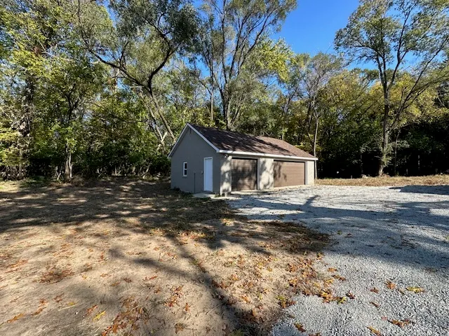 a house with trees in the background