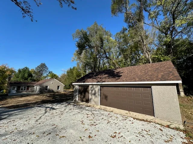 a view of roof with roof deck