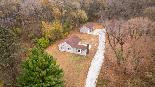 a view of a park with large trees