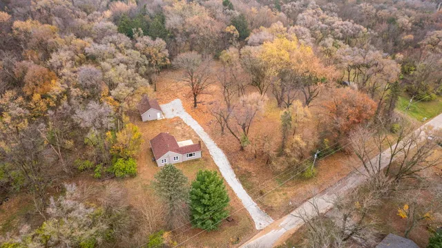 a backyard of a house with large trees