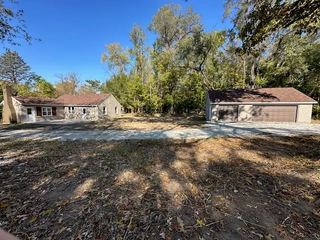 a view of a house with a yard