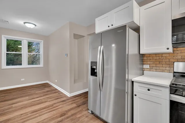 a kitchen with stainless steel appliances a refrigerator sink and stove