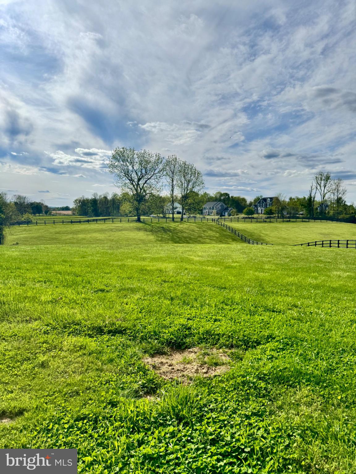 19255 Telegraph Springs Road Purcellville, VA 20132 - Photo 43 of 107 Serene countryside under blue skies.