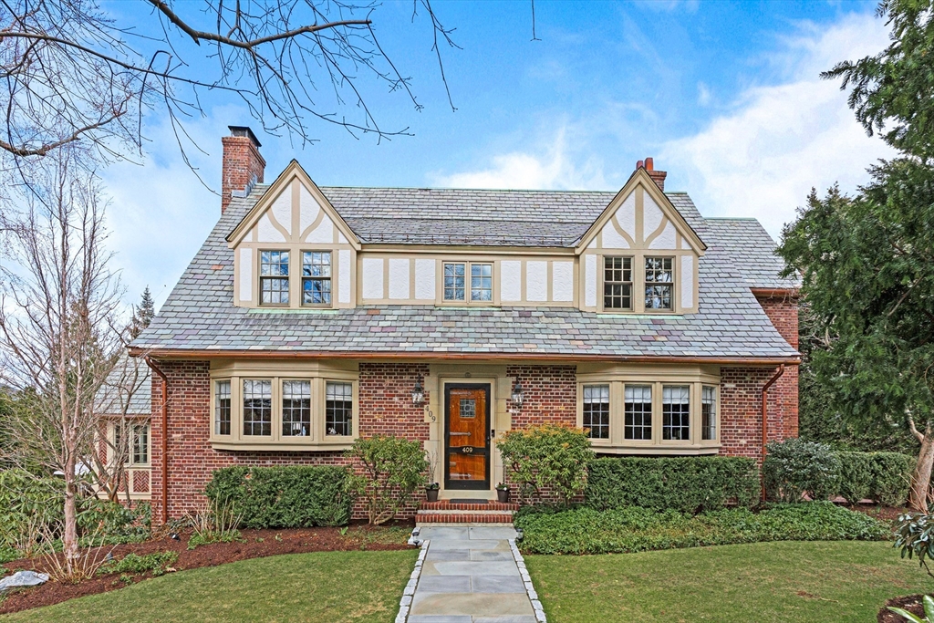 a front view of a house with yard