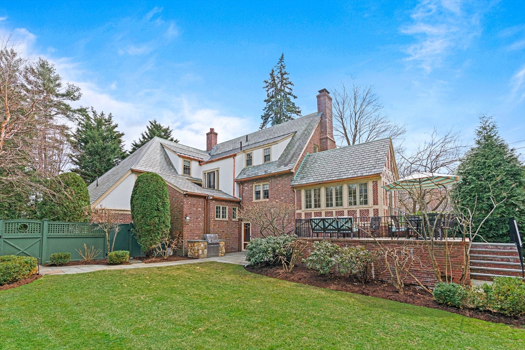 409 Heath Street Brookline, MA 02467 - Photo 29 of 29 a front view of a house with a garden