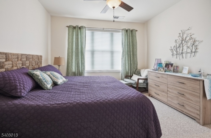 169 Tarrington Road, Unit 203 Hamburg, NJ 07419 - Photo 11 of 15 a bedroom with a large bed and a window