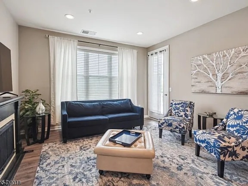 169 Tarrington Road, Unit 203 Hamburg, NJ 07419 - Photo 8 of 15 a living room with furniture and a potted plant
