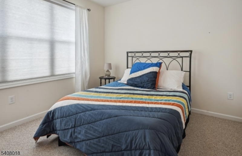 169 Tarrington Road, Unit 203 Hamburg, NJ 07419 - Photo 10 of 15 a bedroom with a bed and window