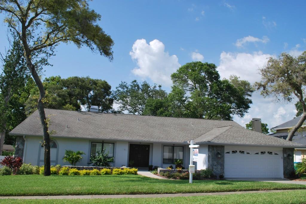 1379 Rolling Ridge Road Palm Harbor, FL 34683 - Photo 1 of 1 BEAUTIFUL NEW PLANTINGS AND PERFECT LAWN. MATURE TREES FRONT AND BACK.