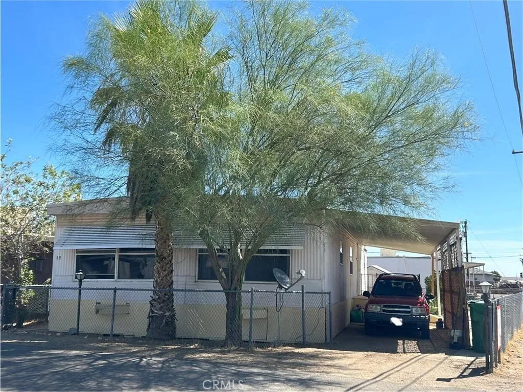 a front view of a house with yard