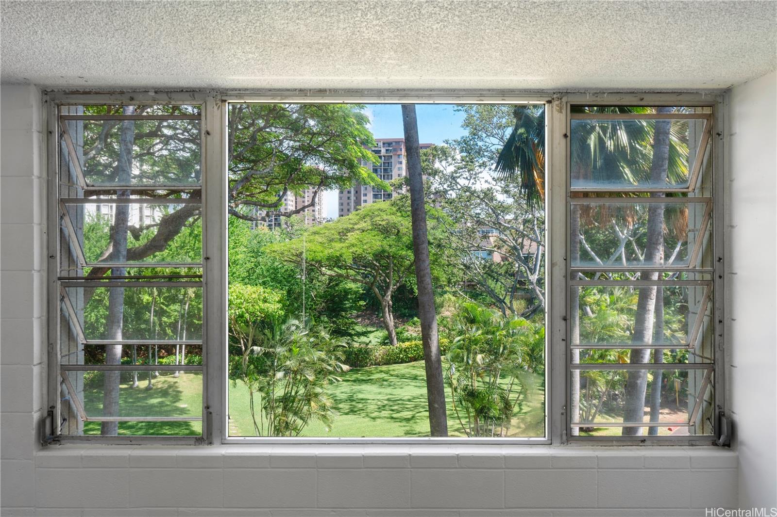 98-1042 Moanalua Road, Unit 2201 Aiea, HI 96701 - Photo 4 of 19 a view of a garden from a window