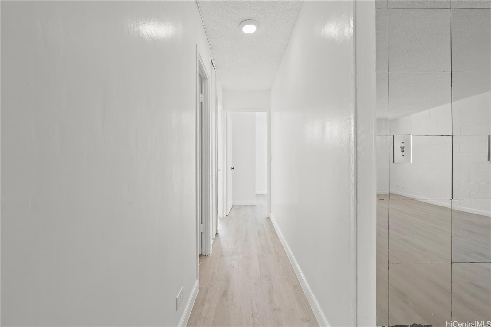 98-1042 Moanalua Road, Unit 2201 Aiea, HI 96701 - Photo 10 of 19 a view of a hallway