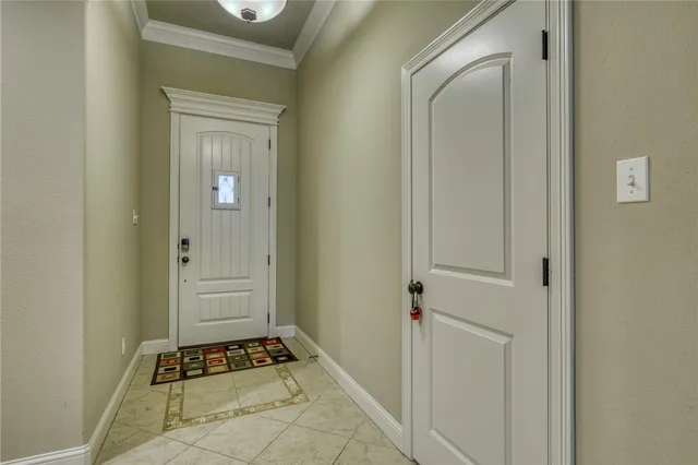 a view of room with walk in closet and wooden floor