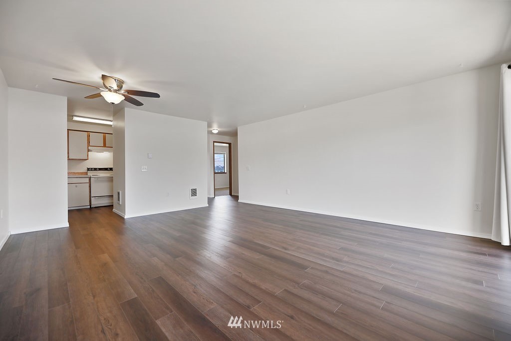 311 Date Street Sultan, WA 98294 - Photo 11 of 29 a view of empty room with wooden floor