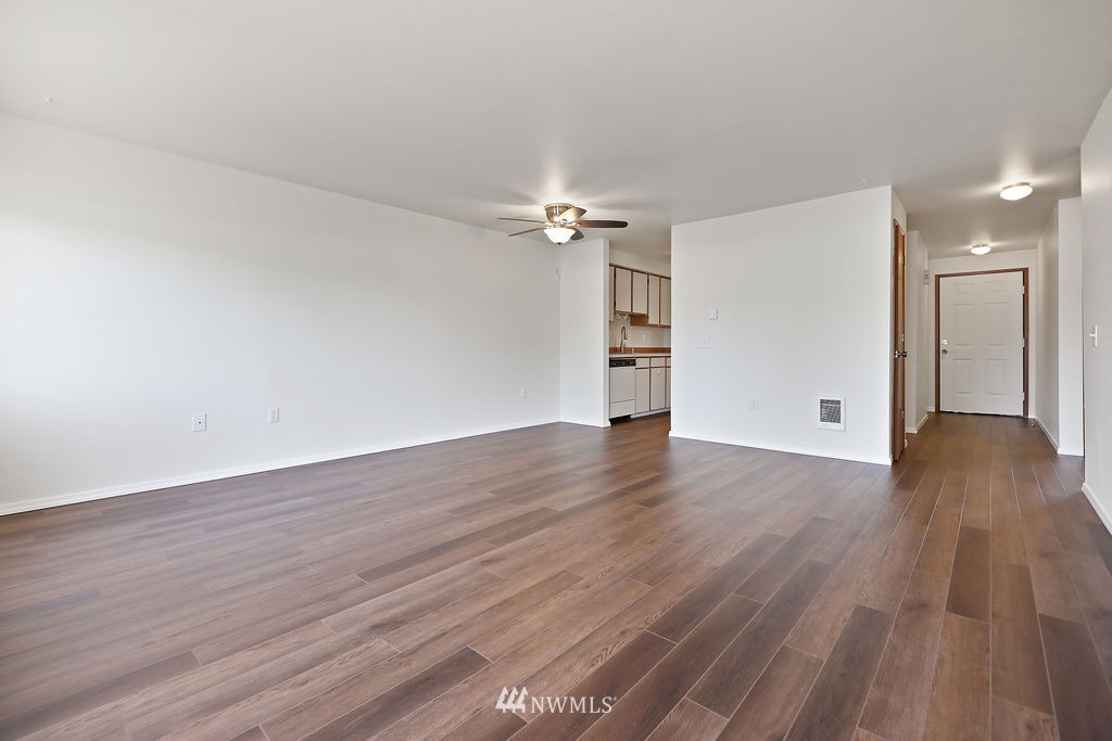 311 Date Street Sultan, WA 98294 - Photo 12 of 29 a view of an empty room with wooden floor