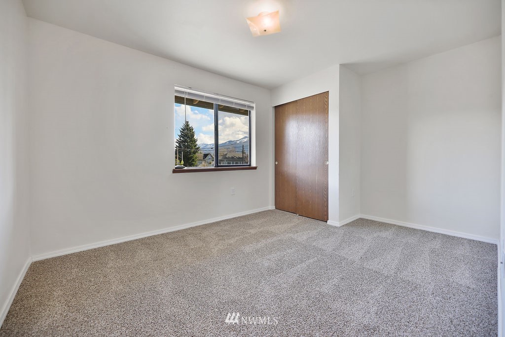 311 Date Street Sultan, WA 98294 - Photo 13 of 29 an empty room with windows and closet
