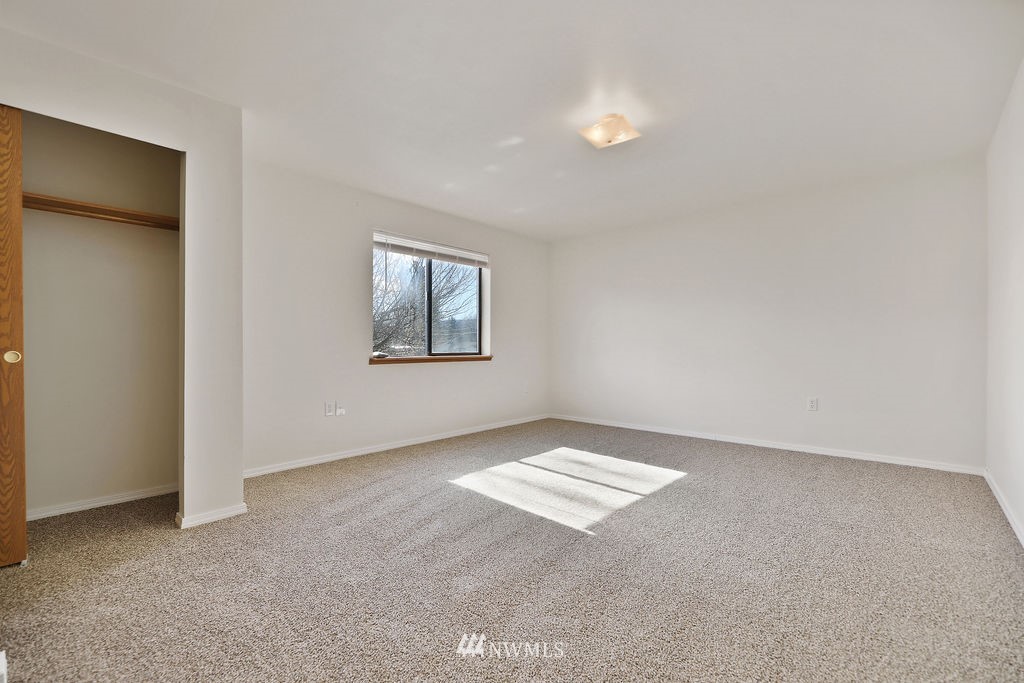 311 Date Street Sultan, WA 98294 - Photo 19 of 29 an empty room with windows