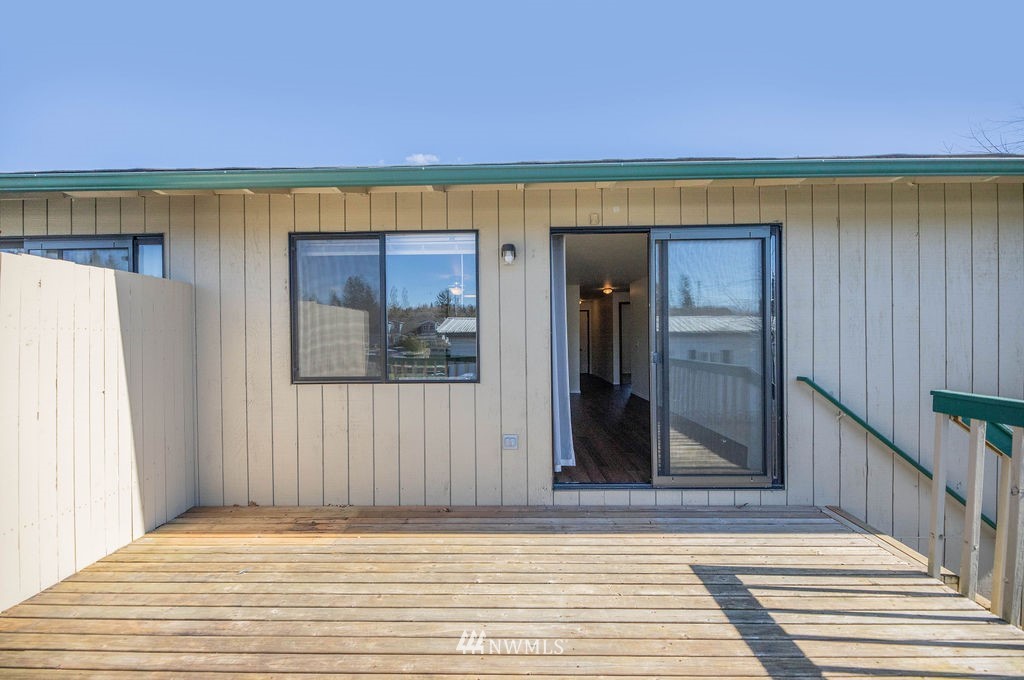 311 Date Street Sultan, WA 98294 - Photo 28 of 29 a view of a room with wooden floor and a floor to ceiling window