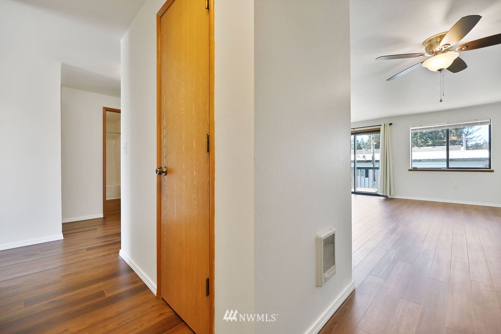 311 Date Street Sultan, WA 98294 - Photo 8 of 29 a view of an entryway with wooden floor and a ceiling fan