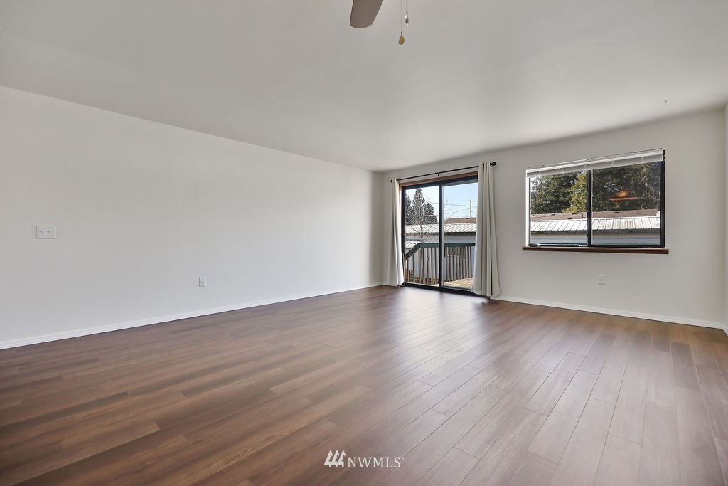 311 Date Street Sultan, WA 98294 - Photo 10 of 29 a view of empty room with wooden floor and fan