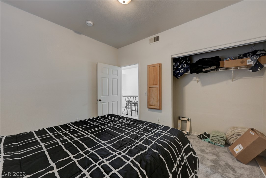 4730 East Craig Road, Unit 1155 Las Vegas, NV 89115 - Photo 18 of 41 An inviting bedroom offers ample space, comfortable carpeting, and a convenient open closet.