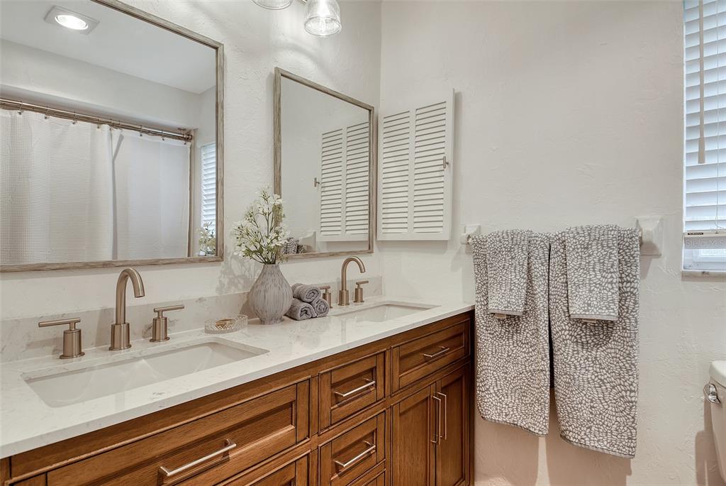 6722 Roxbury Drive Sarasota, FL 34231 - Photo 38 of 87 a bathroom with double vanity sink a mirror and shower