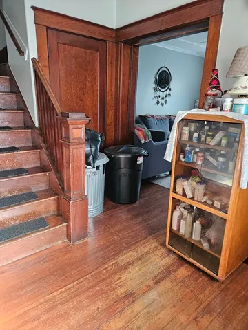 a view of an entryway with wooden floor