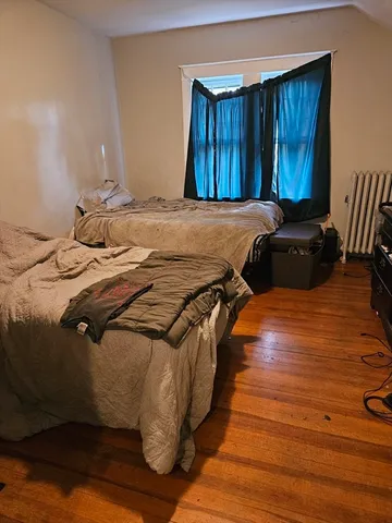 a bedroom with a bed and a closet