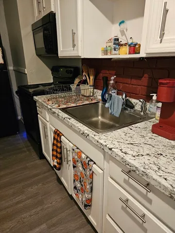 a kitchen with a stove and a sink