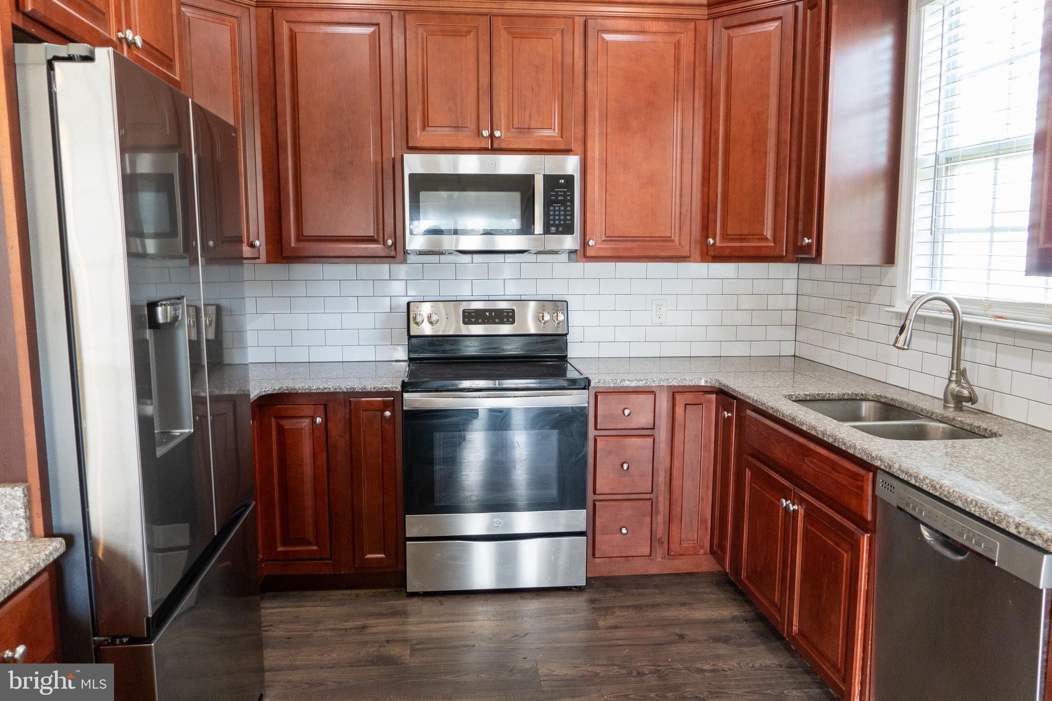 27 Sun Ridge Drive Felton, DE 19943 - Photo 13 of 41 Modern kitchen with rich wood tones.