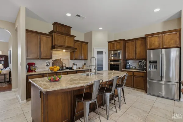 a kitchen with a table and chairs in it