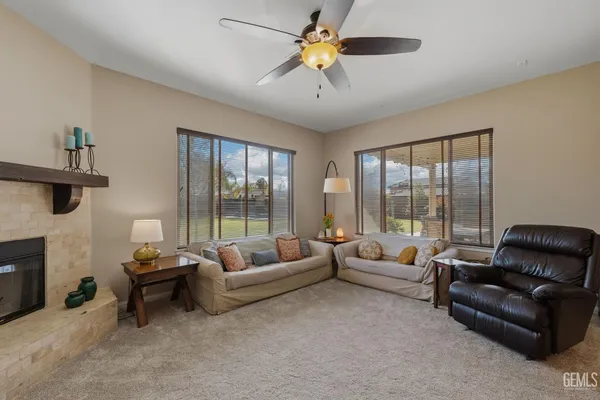 a view of a livingroom with furniture and a potted plant