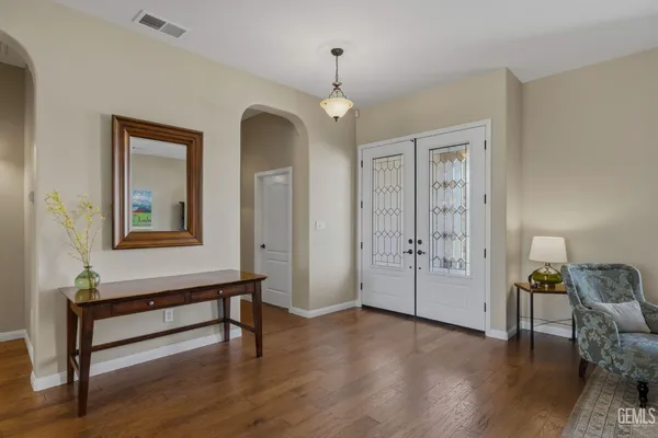 a living room with furniture or wooden floor and a chandelier