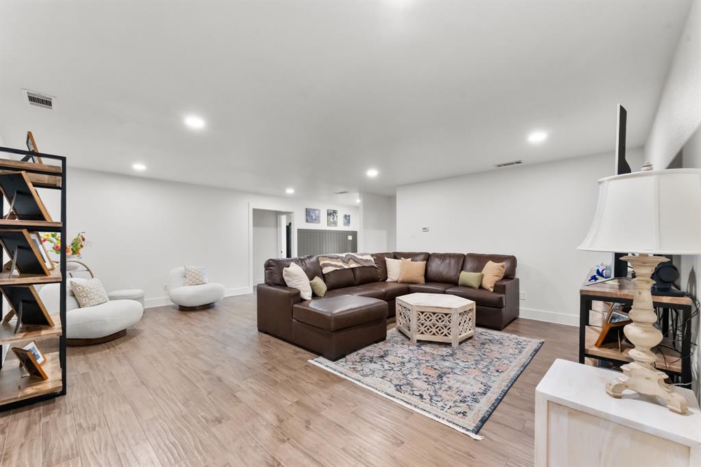 380 Farr Altom Road Seagoville, TX 75159 - Photo 7 of 30 Spacious room featuring wood-finish flooring, recessed lighting, and white walls