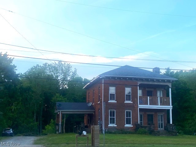5809 North Ridge Road West Ashtabula, OH 44004 - Photo 2 of 7 View of front of property with a front yard and a balcony