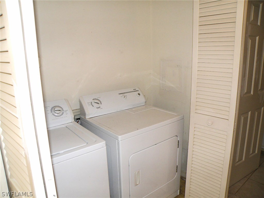 1439 Albatross Road Sanibel, FL 33957 - Photo 14 of 21 a utility room with dryer and washer