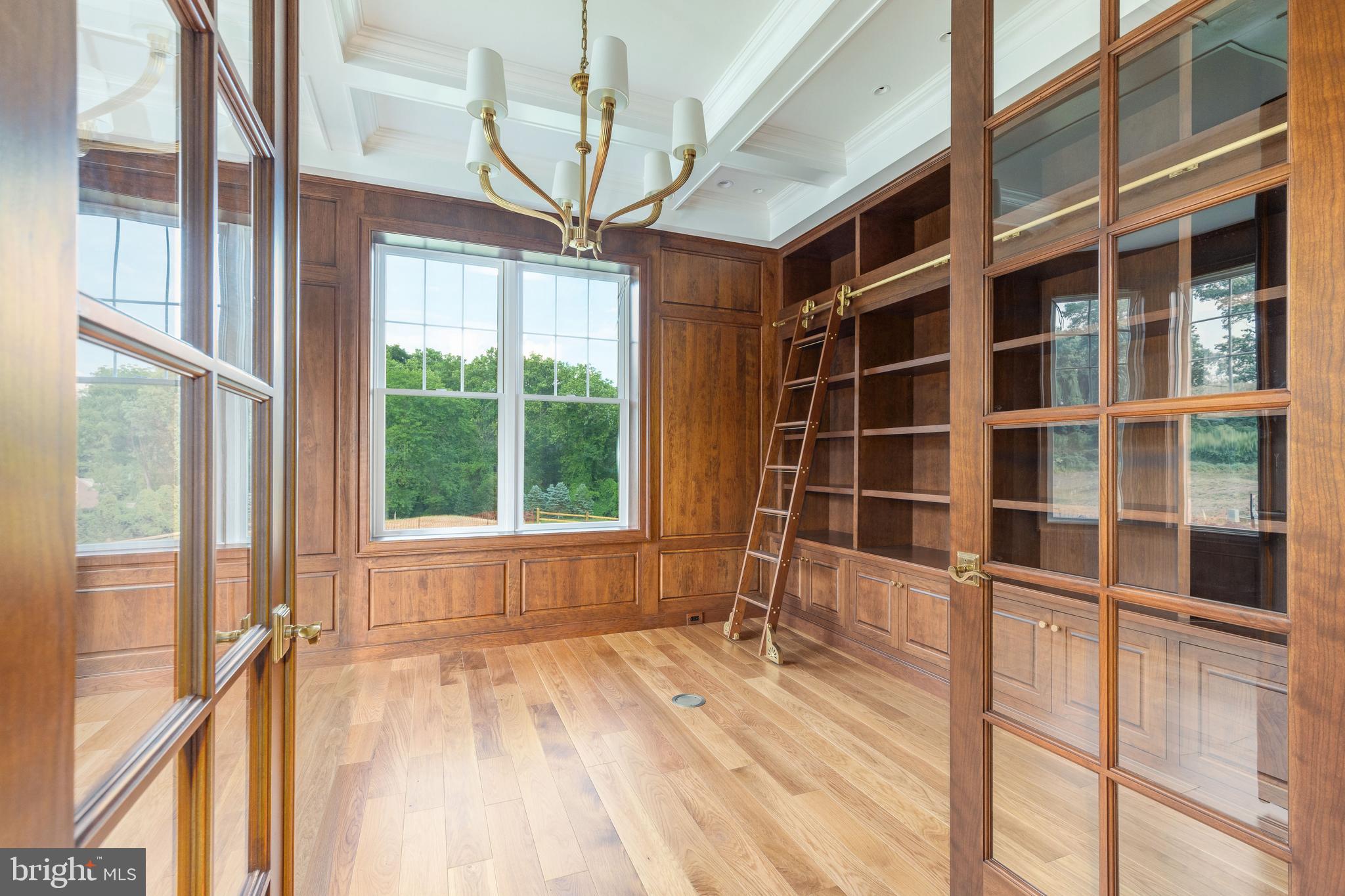 427 Radnor Street Road Wayne, PA 19087 - Photo 11 of 36 a view of an empty room with a window and wooden floor