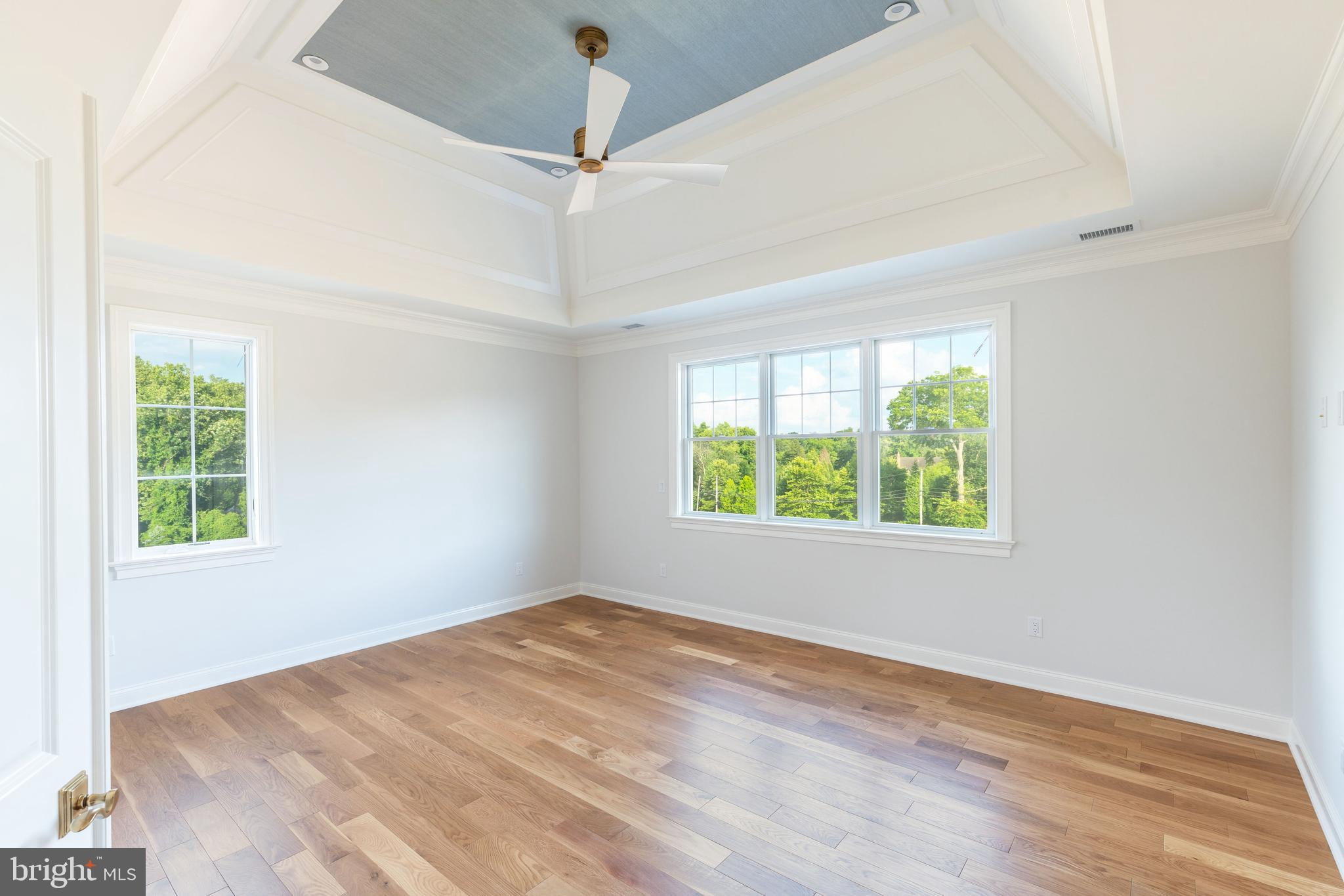 427 Radnor Street Road Wayne, PA 19087 - Photo 17 of 36 an empty room with a window and wooden floor
